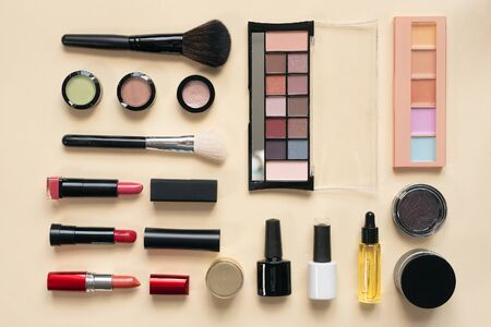 Make up brushes and various cosmetics flat lay background.の写真素材