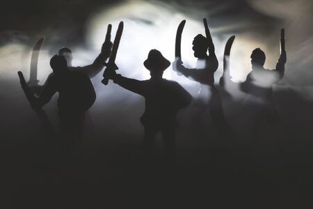 The pirates with swords in the night fog concept.の写真素材