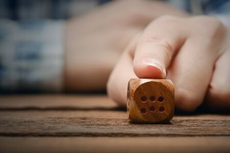 The dice in female hand close up.