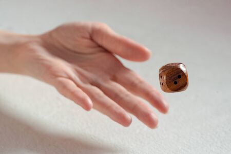 The dice in female hand close up.