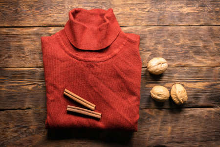 Female jumper on the wooden store counter flat lay background.