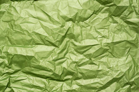Green crumpled paper texture background.の写真素材