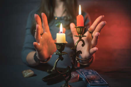 Fortune teller is reading a future by tarot cards.の写真素材
