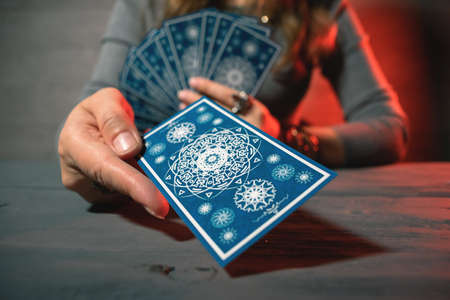 Fortune teller is reading a future by tarot cards.の写真素材
