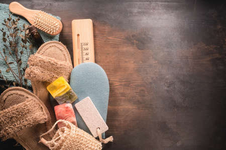 Bathhouse sauna concept background. Hygiene. Bath accessories on the table.