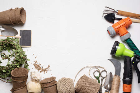 Gardening tools and equipment flat lay concept background with copy space.