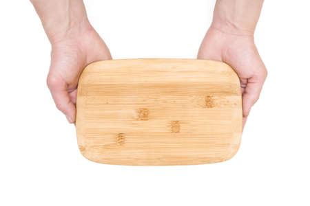 Male hands with a cutting board isolated on the white background top view.の写真素材