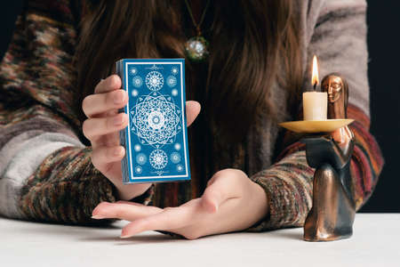 Fortune teller is reading the future with tarot cards close up.の写真素材