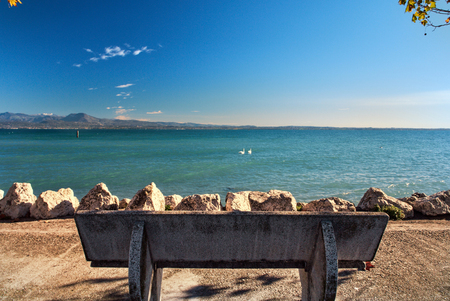 Bench on Sirmione Embankment. Lake Garda. Italyの写真素材