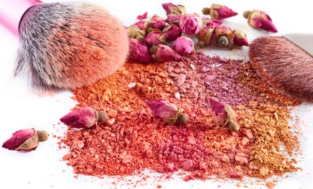 Professional make-up brush on rainbow crushed eyeshadow.