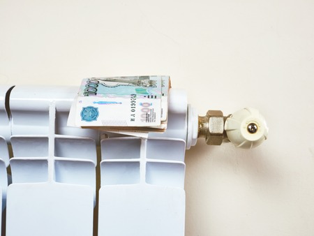Radiator adjustment to save energy. Save energy and money concept HVACの写真素材
