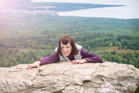 Beautiful woman pleasure wanderlust mindfulness hiking  mountain sunshine Zyuratkul Chelyabinsk Russiaの写真素材