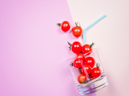 Tomato juice or smoothie, cherry tomato in drink glass with strawの写真素材