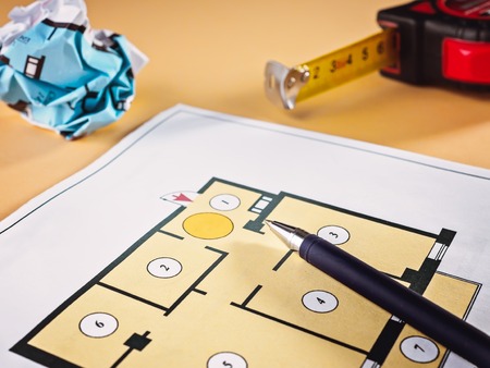 Linking new key on project plan of apartment house Concept new residence house warming Buying Selling Real Estateの写真素材