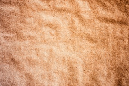 Texture detailed background craft wrapping wrinkled paper parchment recycled  vignetting toned macro shotの写真素材