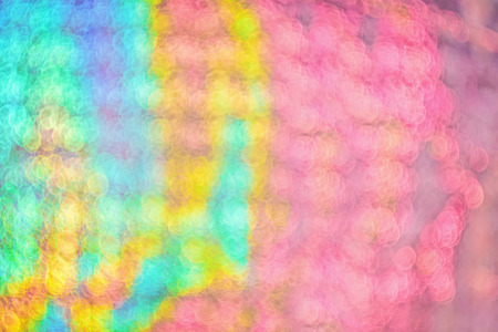 Defocused background light blurred bokeh of festive paper with glitter in soft focus