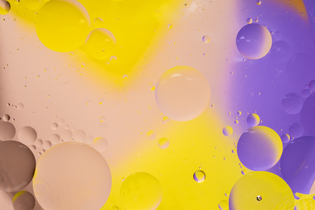 Abstract colorful Background Oil in Water surface Foam of Soap with Bubbles chemical effect macro shot close-up liquids do not mixの写真素材
