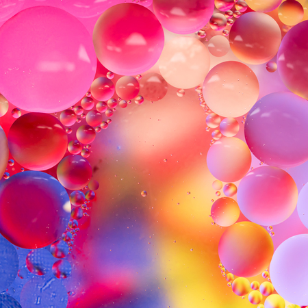 Abstract colorful Background Oil in Water surface Foam of Soap with Bubbles chemical effect macro shot close-up liquids do not mixの写真素材