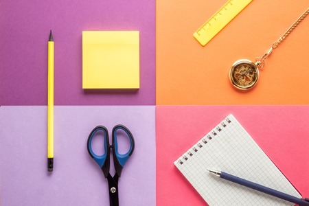 Set of school and preschool childrens accessories for learning letter drawing education on background of multi colored paper Concept Back to school copy space close-up top view.の写真素材