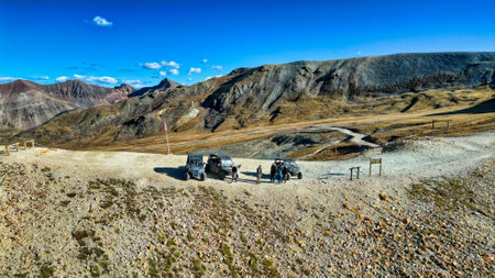 Group of Trucks Parked on Dirt Road in Mountains (Engineer Pass on the Alpine Loop)の写真素材