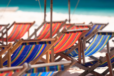 Beach chairs and parasol on Koh Khai island. Phuket, Thailand.の写真素材