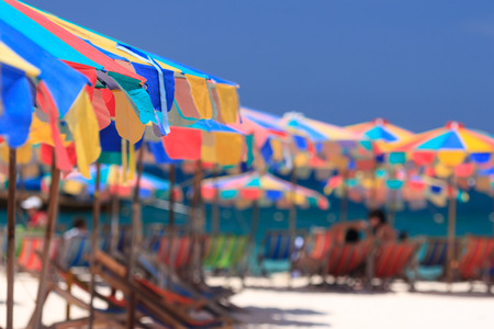 Beach chairs and parasol on Koh Khai island. Phuket, Thailand.の写真素材