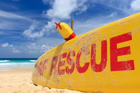 Yellow surf rescue board  by the sea beach.の写真素材