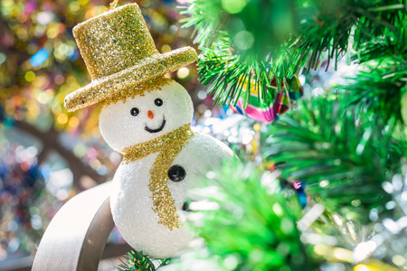 Close up of snow man and bokeh background, Christmas background.の写真素材