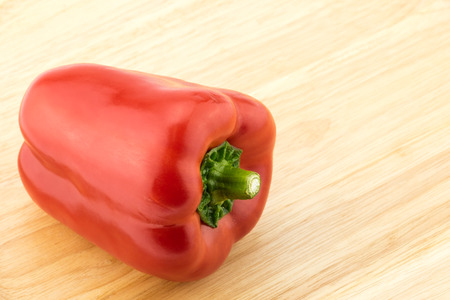 Red capsicum pepper in wooden dish.の写真素材