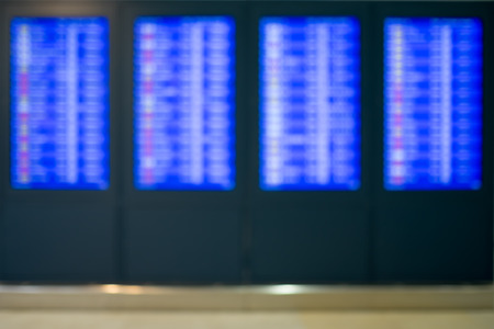 Blurry image of flight schedule board.の写真素材