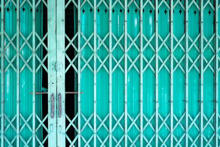 Folding old metal door gate.の写真素材