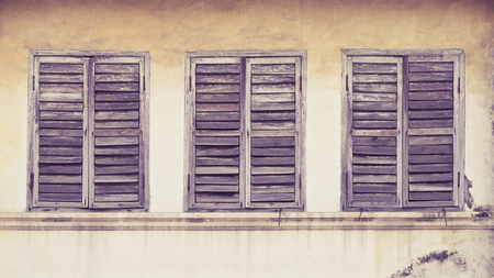 The Old window on wall background. Vintage color style.の写真素材
