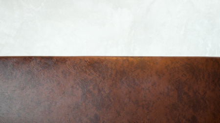 Vintage brown leather Sofa against white wall background.の写真素材