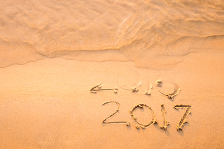 Happy New Year 2017 replace 2016 text on the sea beach, New Year is coming concept.の写真素材