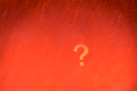 Abstract background of Question mark shape bokeh in red tone.の写真素材