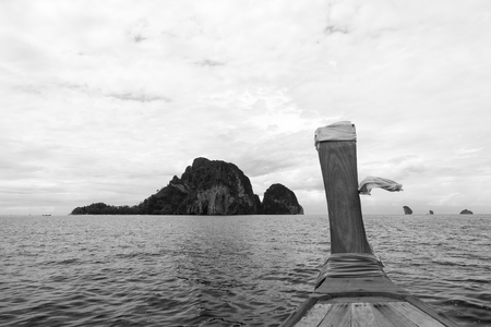 Long tail boat near small island in Krabi, Thailand. Black and white tone.の写真素材