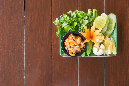 Nam Prik Goong Siab on wooden table.  Popular chili paste of Thailand.の写真素材