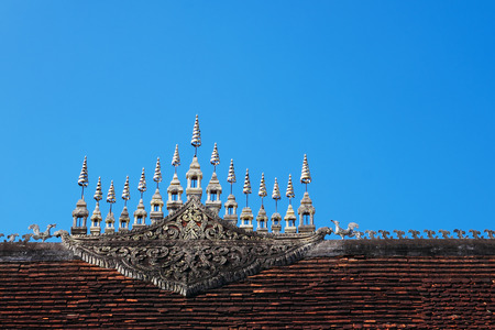 Gable apex in top layer of Luang Prabang temple roof in Laos.の写真素材