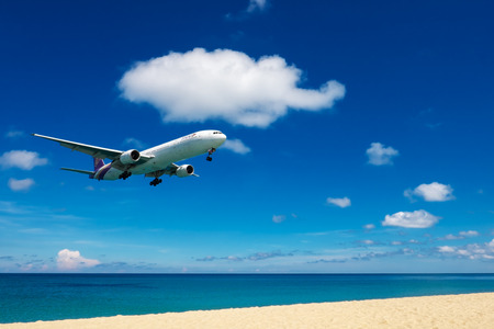 PHUKET, Thailand - April 8th, 2017 : Thai airways airplane landing at Phuket International Airport, Mai Khao Beach, Phuket province, Southern of Thailand.のeditorial素材