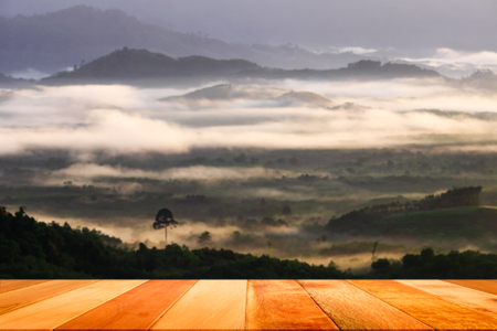 Empty wood table top on blur Khao Khai Nui viewpoint in the morning, Thai Muang, Phang Nga, Thailand.の写真素材