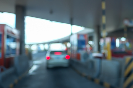Blurred image of drivers pays road toll on highway.の写真素材