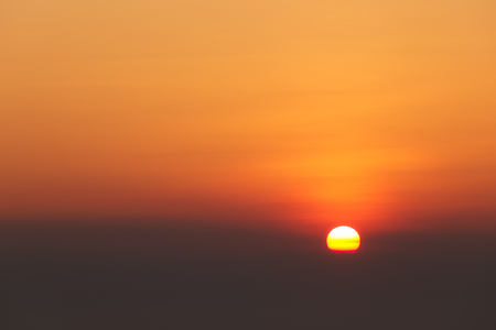 Sun with cloudy sky at sunset.の写真素材