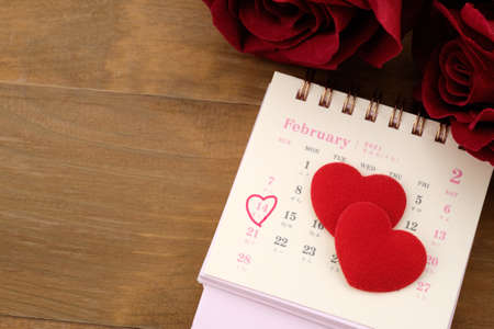 Calendar placed on a old wooden table, Top view, Valentine's day concept.