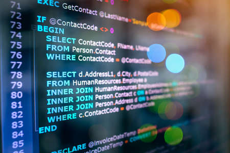 SQL (Structured Query Language) code on computer monitor and server ...
