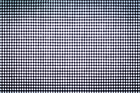 Abstract blurred black wall with tiny small holes.
