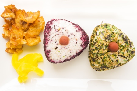 Common Hawaiian food, ume rice musubi, one with yukari and one with furikake with mochiko fish and...