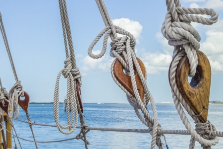 Wooden deadeyes with rope on a sailing vessel