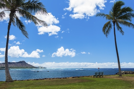A view of popular surf break Ala Moana Bowls and Diamond Head from Magic Island on Oahu, Hawaiiの写真素材