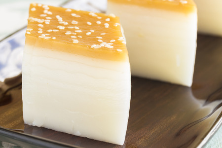 Layered Chinese rice cakes with sesame seed toppingの写真素材