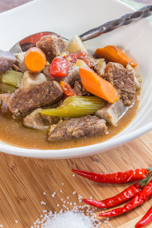 Hearty stew made with beef, taro, vegetables and seasoningsの写真素材
